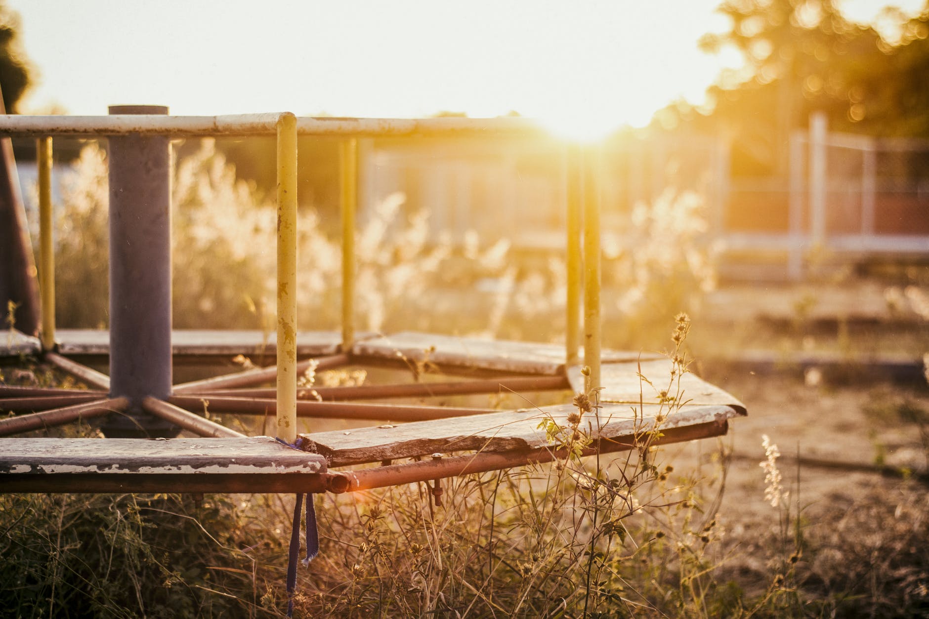 abandoned grass light merry go round